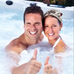 happy couple relaxing in hot tub
